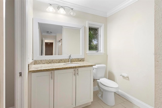 bathroom featuring vanity, toilet, ornamental molding, and tile patterned flooring