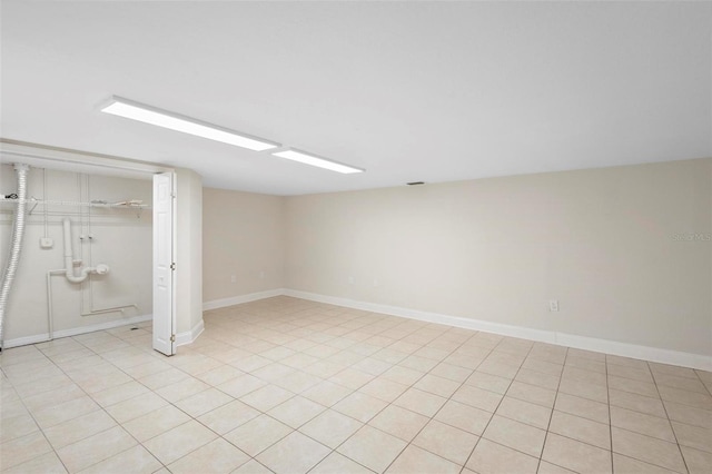 basement featuring light tile patterned flooring