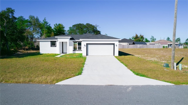 single story home with a garage and a front yard