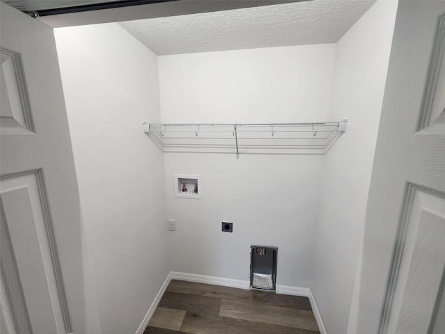 clothes washing area with washer hookup, hardwood / wood-style flooring, hookup for an electric dryer, and a textured ceiling