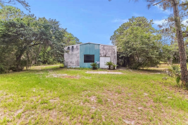 view of outbuilding with a lawn