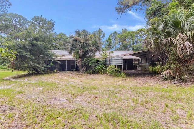 view of yard featuring a carport