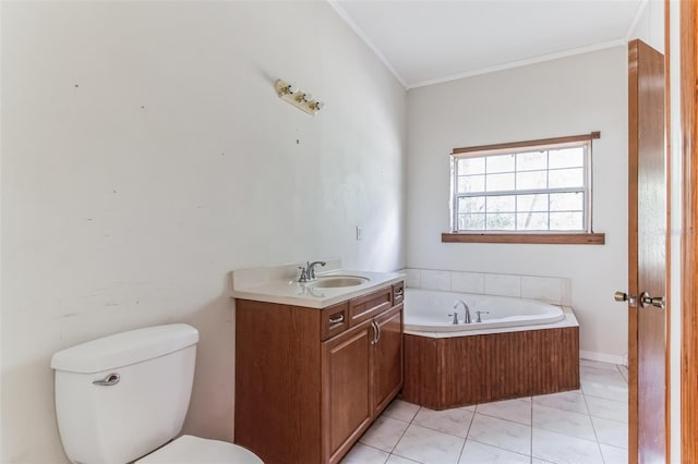 bathroom with a tub to relax in, vanity, ornamental molding, toilet, and tile patterned floors