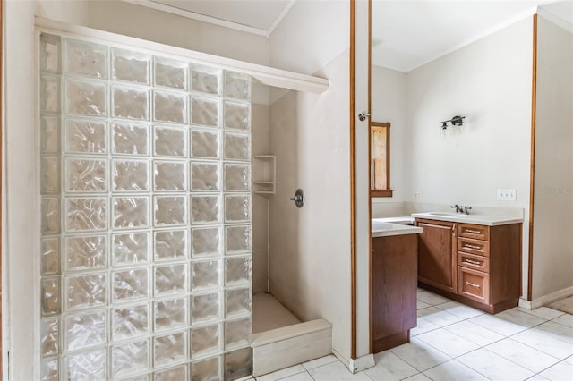 bathroom with tile patterned flooring, vanity, and a shower