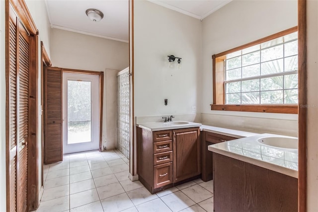 bathroom with vanity, a wealth of natural light, and tile patterned floors