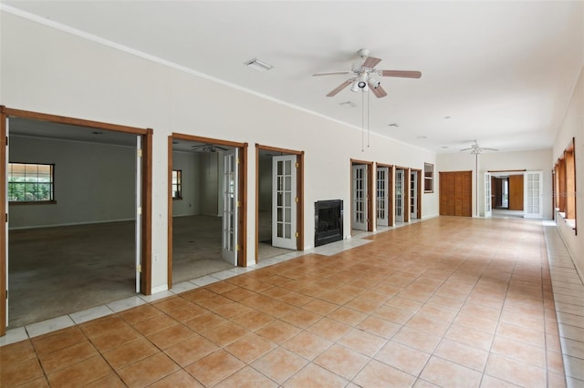 unfurnished room featuring light tile patterned flooring and ceiling fan