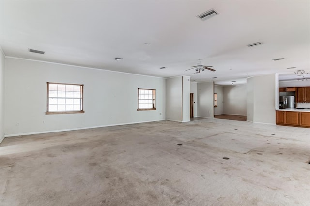 carpeted spare room featuring ornamental molding and ceiling fan