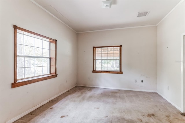 spare room with crown molding and light colored carpet