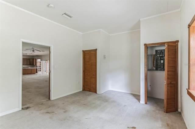 unfurnished bedroom with ornamental molding and light carpet