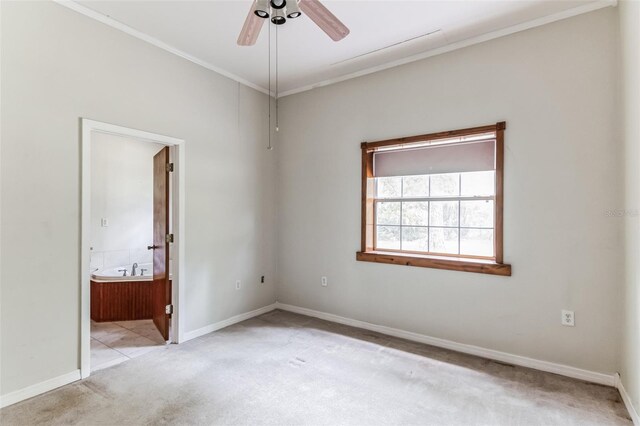 empty room featuring light carpet and ceiling fan