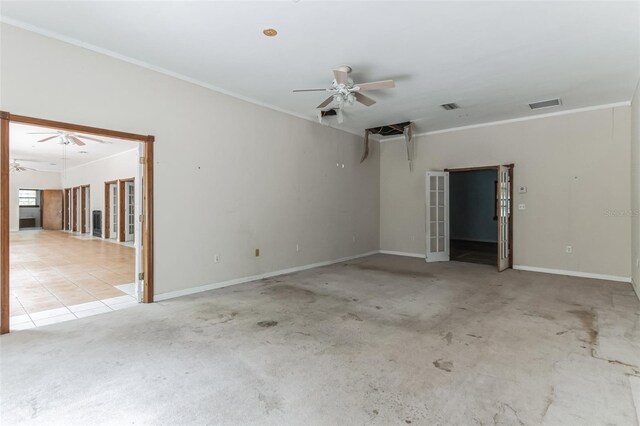 tiled spare room with ceiling fan and ornamental molding