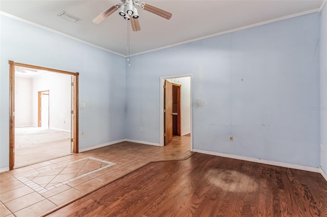 spare room featuring crown molding, light hardwood / wood-style floors, and ceiling fan