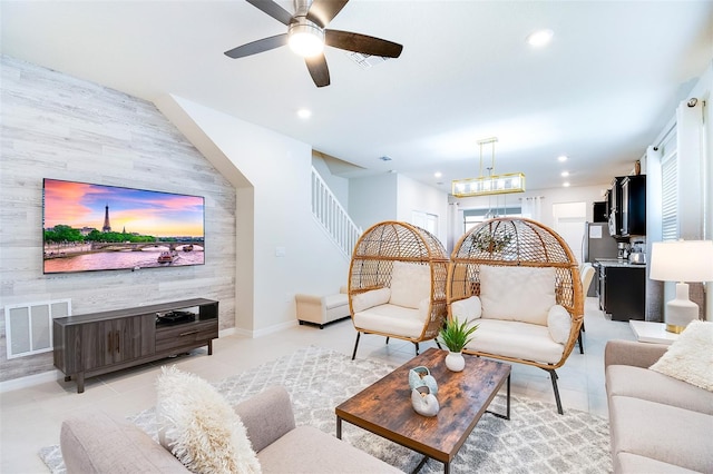 tiled living room with ceiling fan