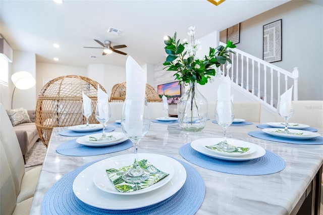 dining space with ceiling fan