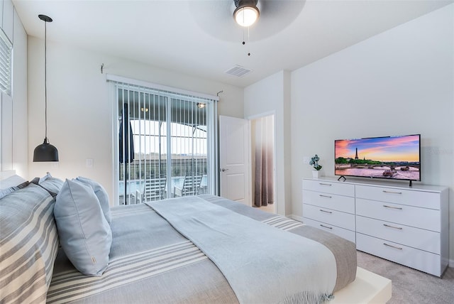 bedroom with light carpet, access to exterior, and ceiling fan