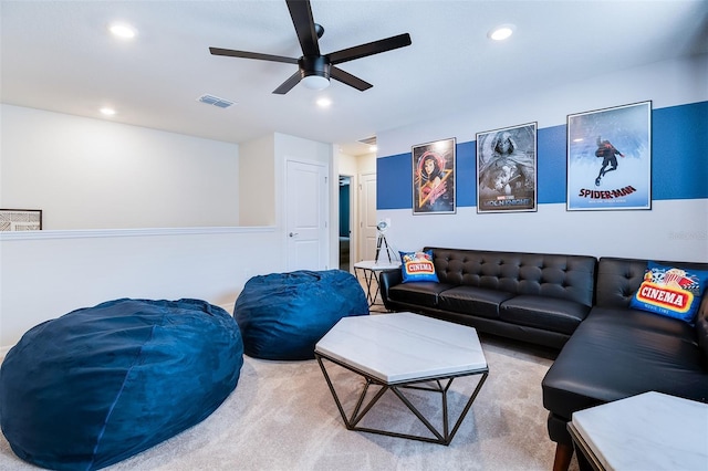 living room featuring carpet floors and ceiling fan