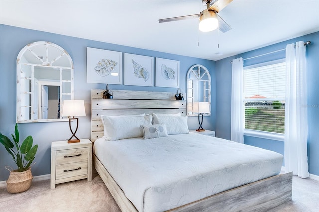 bedroom featuring light colored carpet and ceiling fan