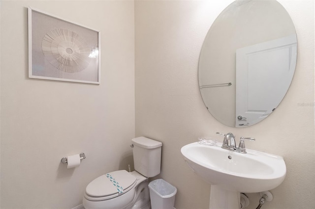 bathroom with sink and toilet