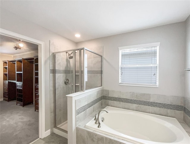 bathroom featuring separate shower and tub