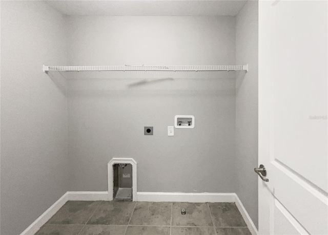 laundry room with electric dryer hookup, tile patterned floors, and hookup for a washing machine