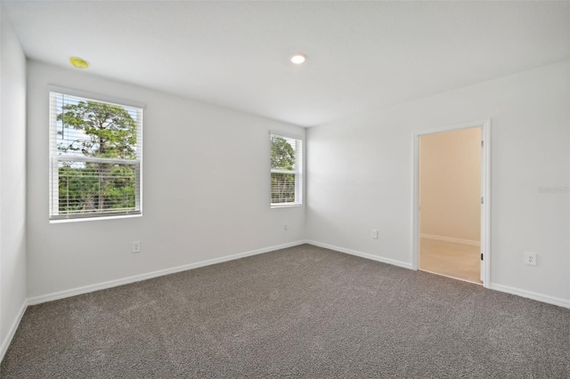 unfurnished room with carpet floors