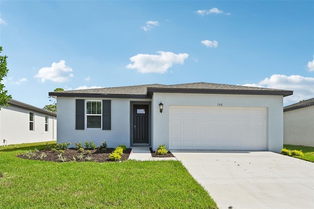 view of front of house featuring a front lawn and a garage