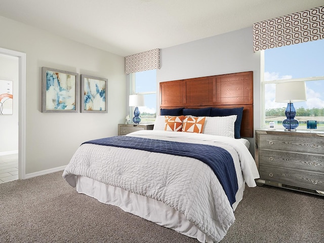 bedroom with carpet flooring and multiple windows