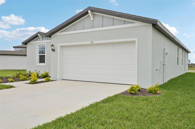 view of front of property with a garage, concrete driveway, board and batten siding, and stucco siding