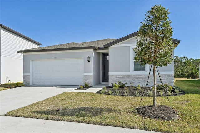 view of front of house with a front lawn and a garage