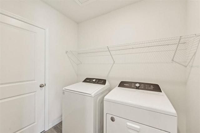 washroom featuring washer and clothes dryer