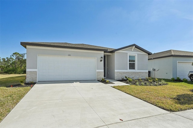 ranch-style home featuring a front yard and a garage