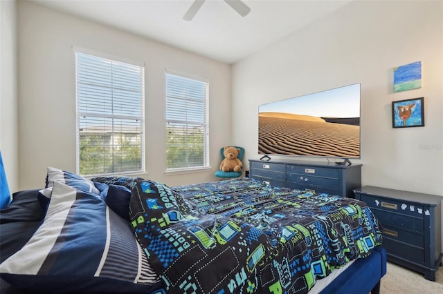 bedroom with ceiling fan and light colored carpet