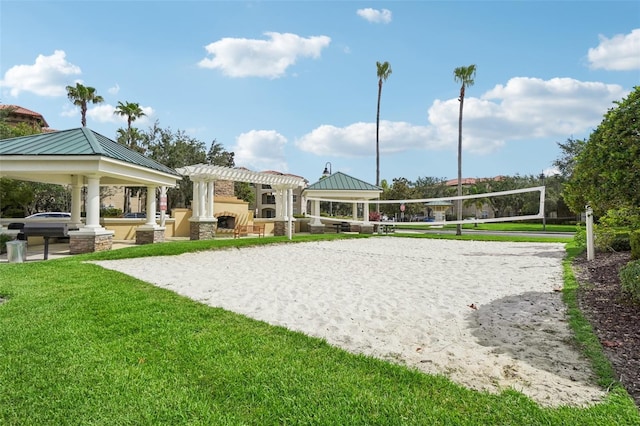 view of property's community featuring a gazebo, a yard, and volleyball court