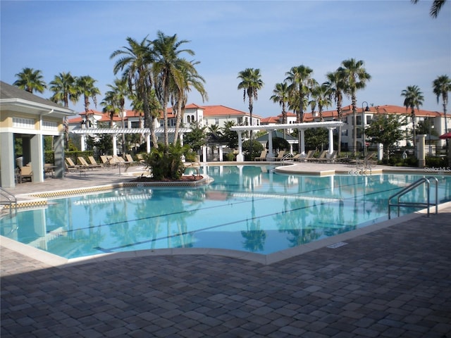 view of swimming pool with a patio