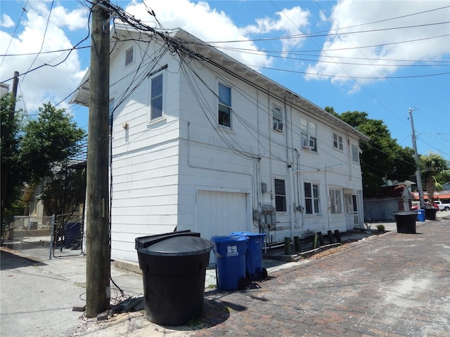 rear view of house featuring a garage