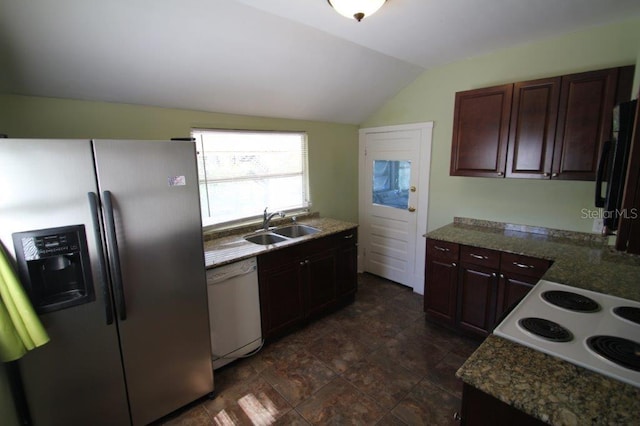 kitchen with stainless steel fridge, white dishwasher, sink, stovetop, and lofted ceiling