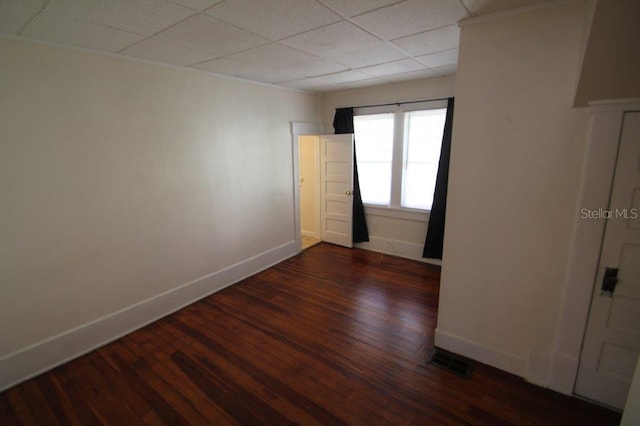 unfurnished room featuring dark wood-type flooring