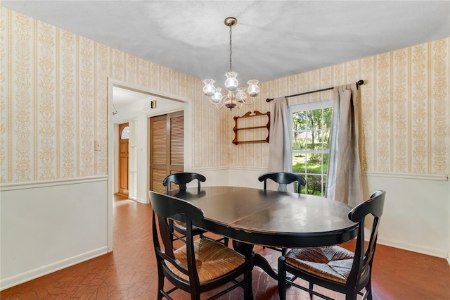 dining space with a notable chandelier