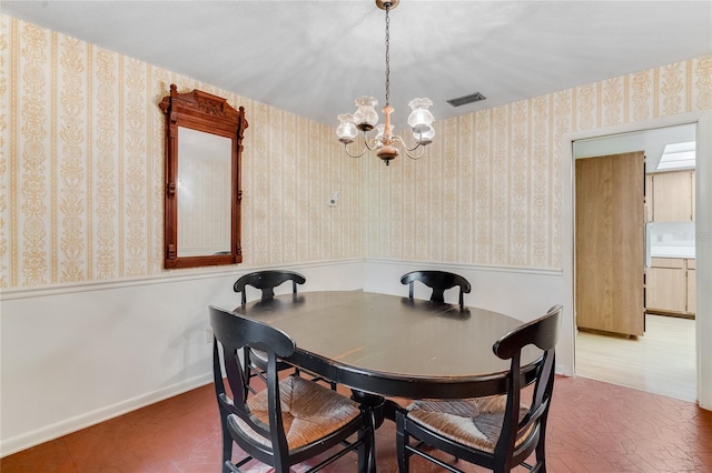 dining room featuring a chandelier