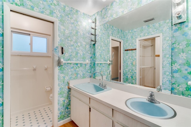 bathroom with vanity and toilet