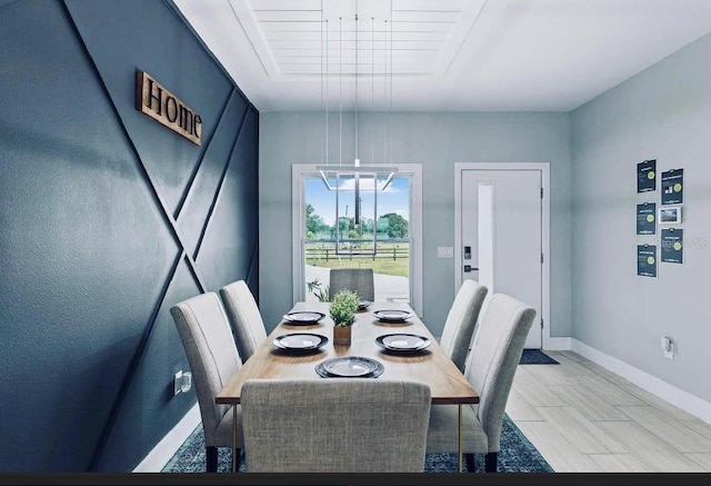 dining space featuring a chandelier and light tile patterned floors