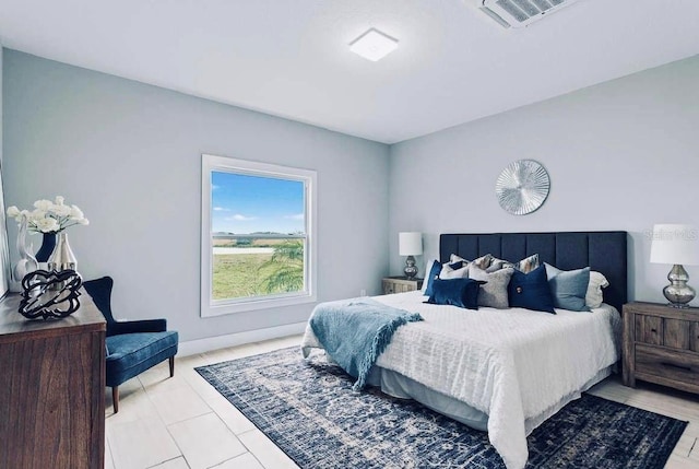 bedroom featuring light tile patterned floors