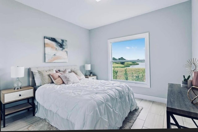 bedroom featuring multiple windows