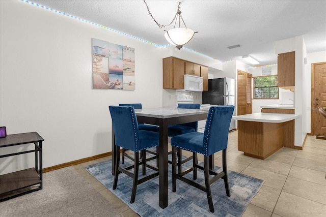 dining room with light tile patterned floors