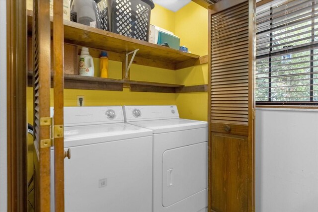 clothes washing area with independent washer and dryer