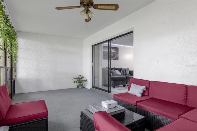 interior space with outdoor lounge area and ceiling fan