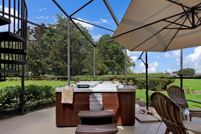 view of patio / terrace with a lanai