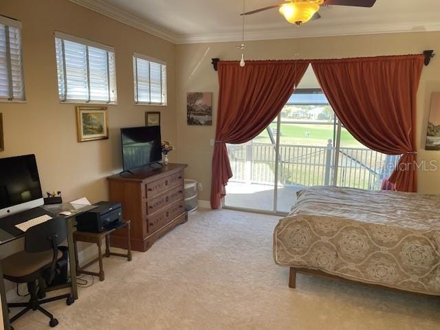 carpeted bedroom featuring ceiling fan, access to exterior, and ornamental molding