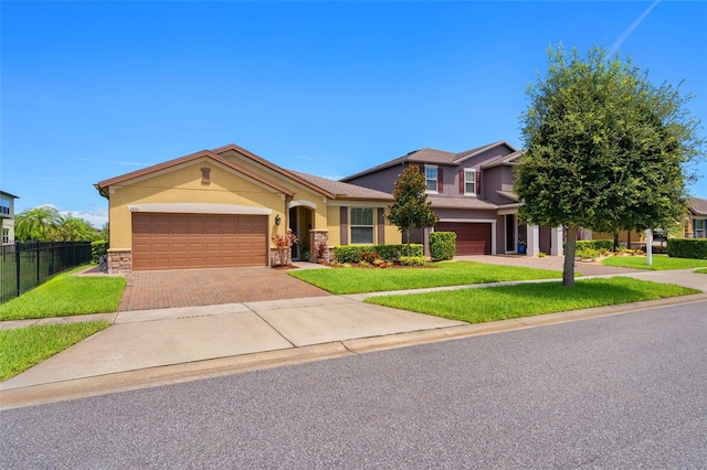 view of front facade featuring a garage and a front yard