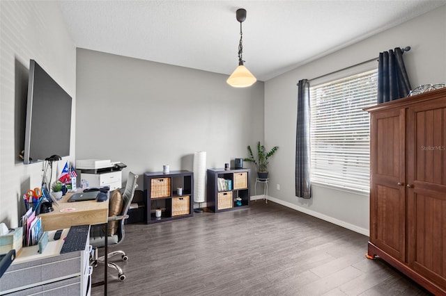 office space with dark wood-type flooring